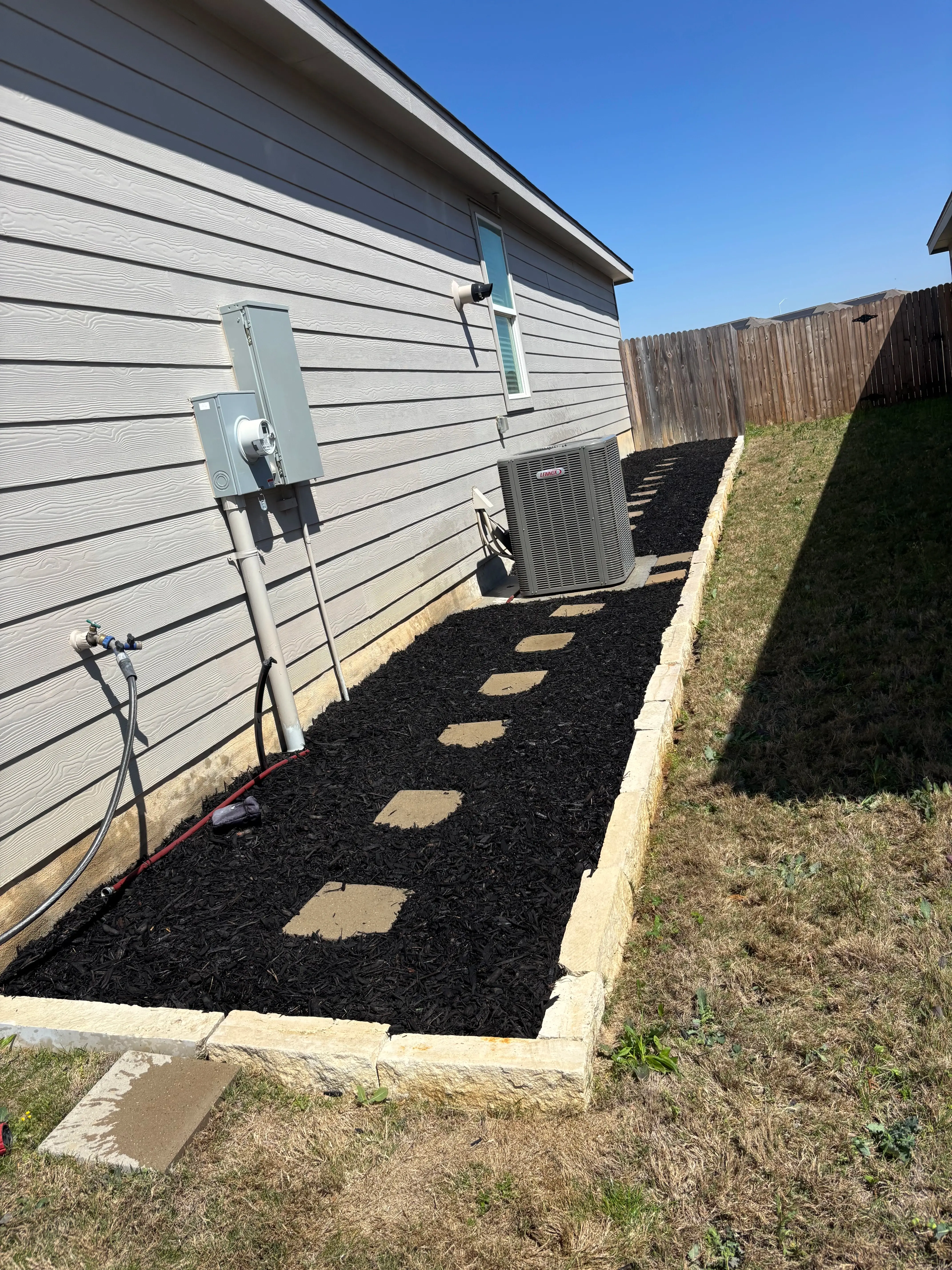 Mulch side yard, clean and well kept.